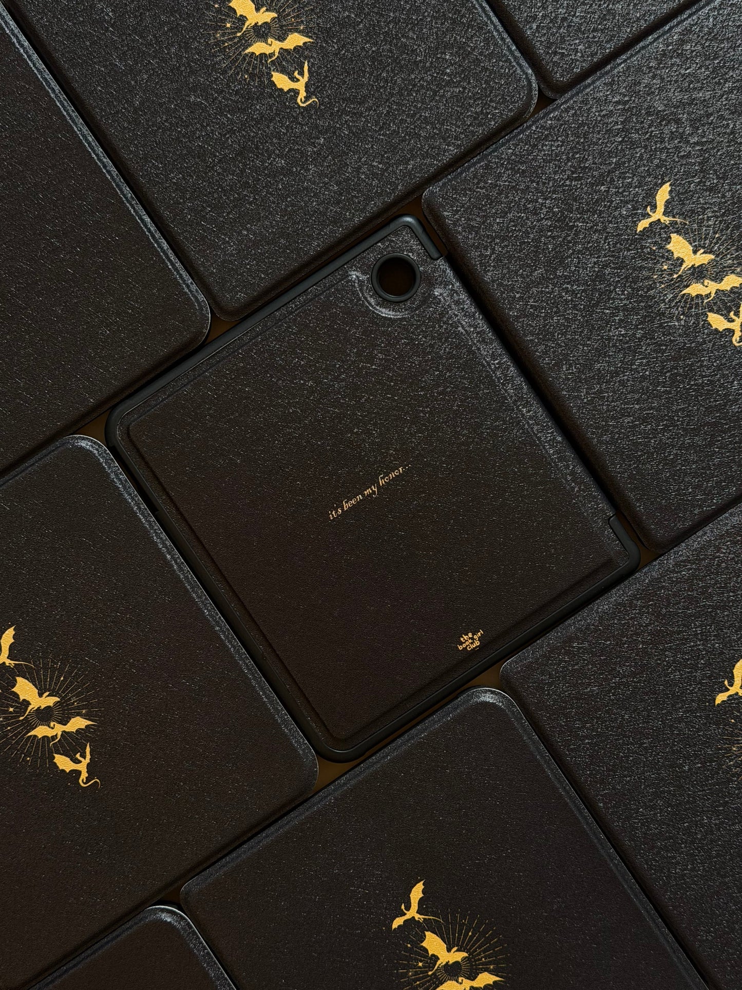 Kobo case with yellow gold decorative elements on a black background