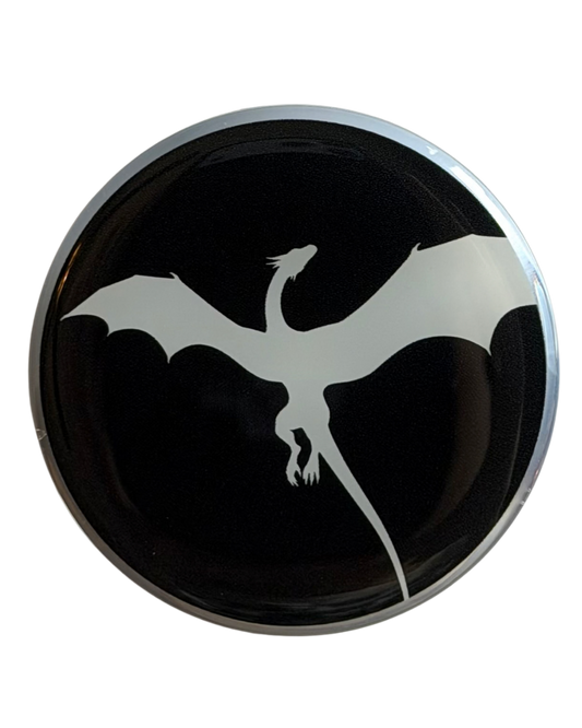 Round black magnetic grip with a white dragon design on a black background